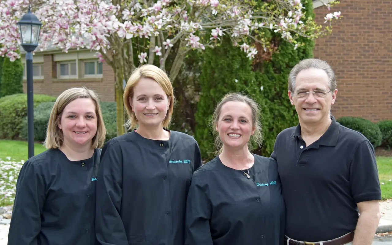 Hygienists and a doctor outside the practice in Severna Park.